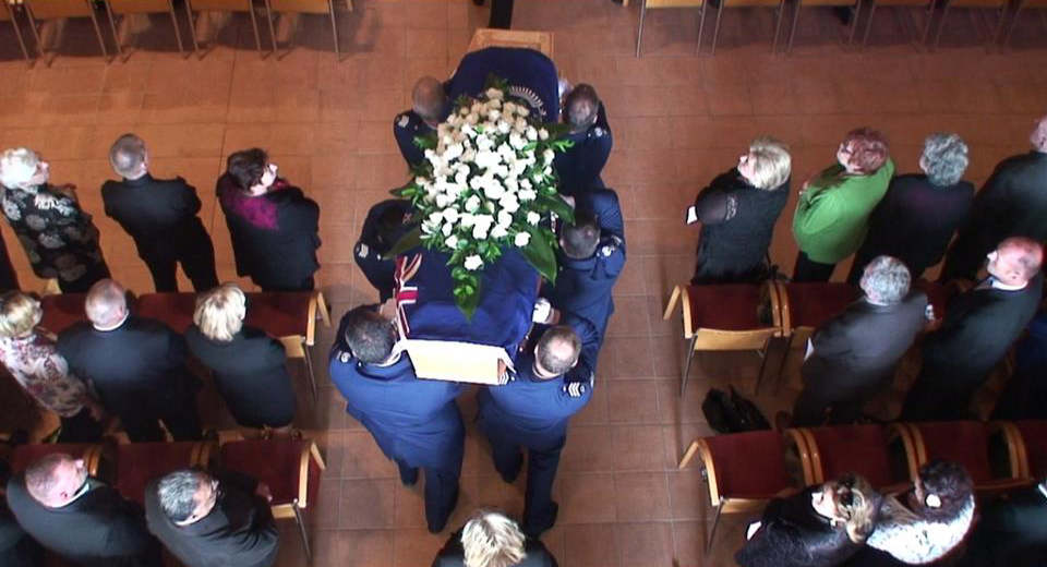 Still frame capture of casket being pallbeared into the Holy Trinity Cathedral, Parnell, Auckland
